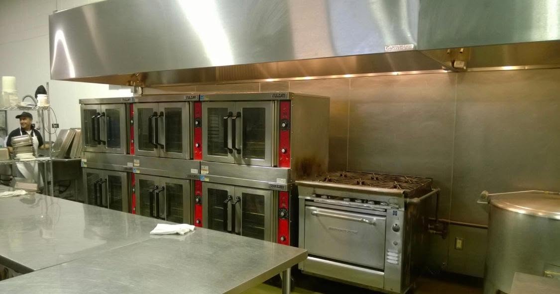 Premier Kitchen commercial ovens and food preparation area in New Hope